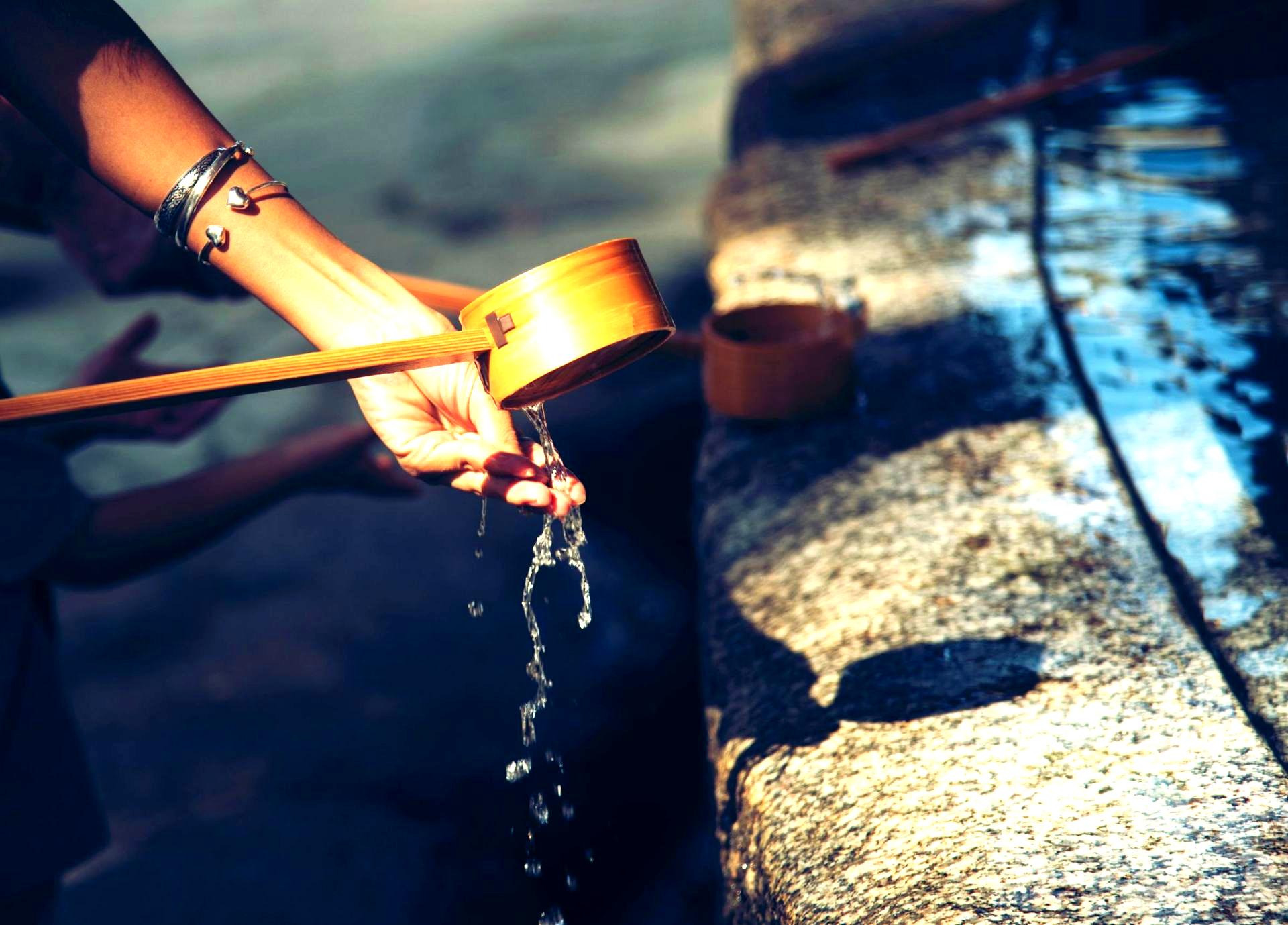 Image of a human checking water.
